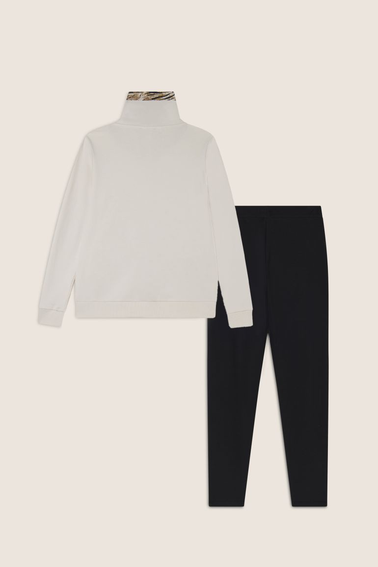 Tuta interlock con zip e collo alto interno fantasia